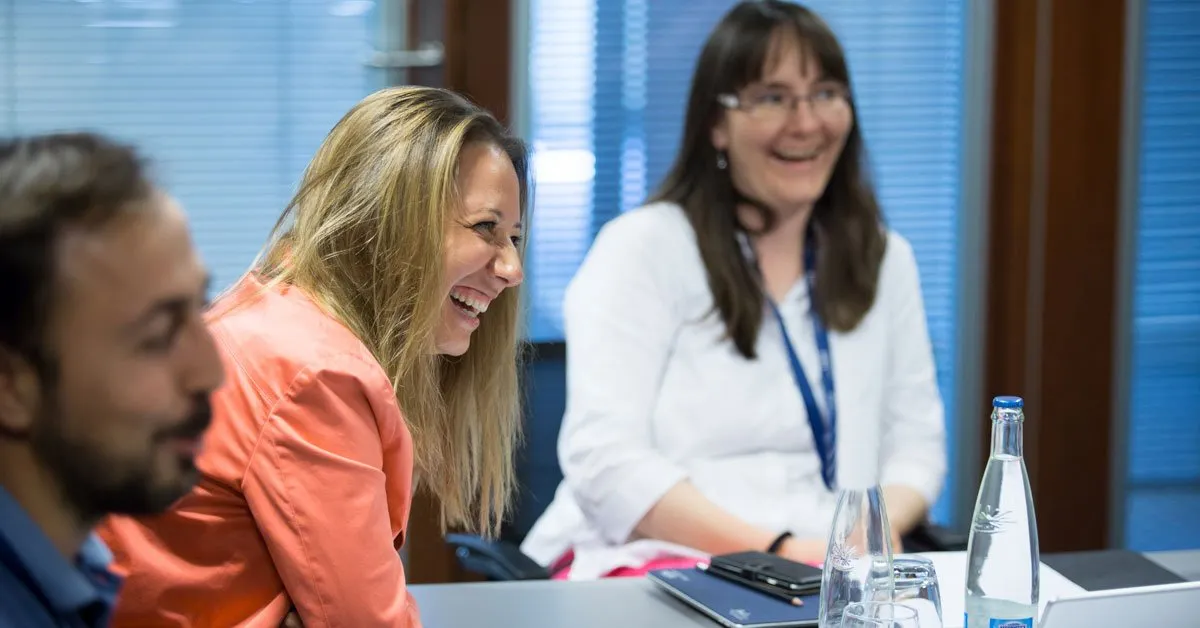 EMBA participants laughing together during the introduction week