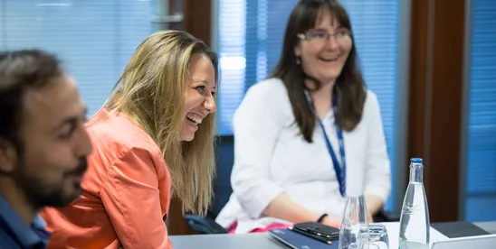 EMBA participants laughing together during the introduction week